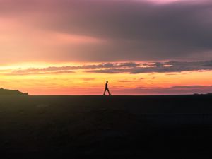 Preview wallpaper man, silhouette, sunset, horizon, reflection