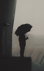 Preview wallpaper man, silhouette, umbrella, pipes, fog, dark