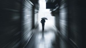 Preview wallpaper man, silhouette, umbrella, tunnel, alone