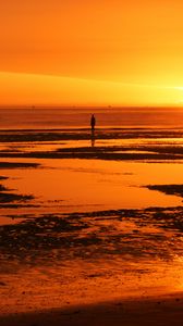 Preview wallpaper man, silhouette, water, horizon, sunset, alone