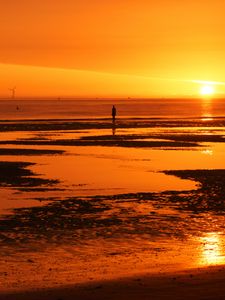 Preview wallpaper man, silhouette, water, horizon, sunset, alone