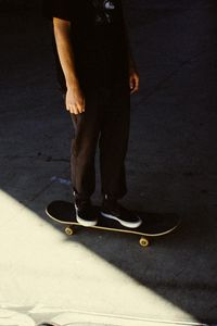 Preview wallpaper man, skateboard, legs, asphalt, shadow