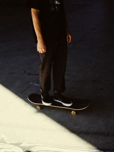 Preview wallpaper man, skateboard, legs, asphalt, shadow