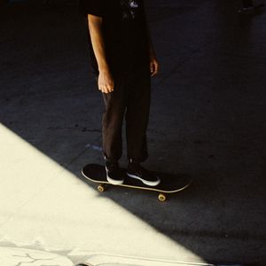 Preview wallpaper man, skateboard, legs, asphalt, shadow