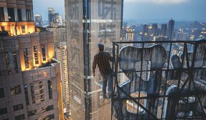 Preview wallpaper man, skyscraper, buildings, city