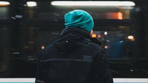 Preview wallpaper man, snow, glare, street