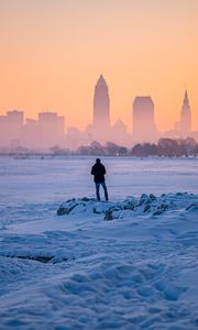 Preview wallpaper man, snow, loneliness, city, winter