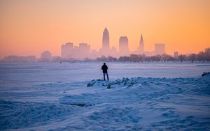 Preview wallpaper man, snow, loneliness, city, winter