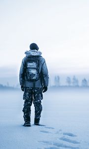 Preview wallpaper man, snow, tourist, backpack, winter