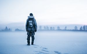 Preview wallpaper man, snow, tourist, backpack, winter