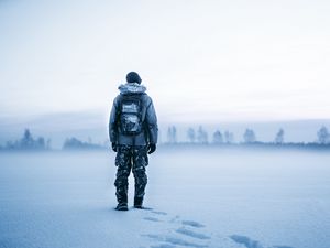 Preview wallpaper man, snow, tourist, backpack, winter