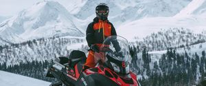 Preview wallpaper man, snowmobile, helmet, slope, snow