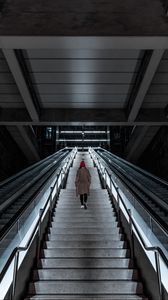 Preview wallpaper man, stairs, alone, sad, escalator, building, architecture