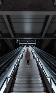 Preview wallpaper man, stairs, alone, sad, escalator, building, architecture