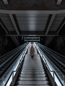 Preview wallpaper man, stairs, alone, sad, escalator, building, architecture