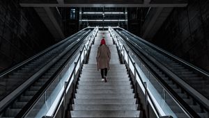 Preview wallpaper man, stairs, alone, sad, escalator, building, architecture