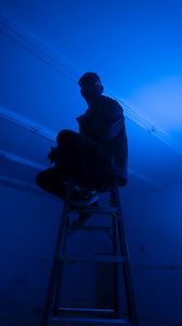 Preview wallpaper man, stepladder, dark, neon, blue