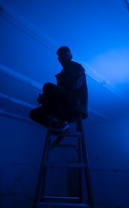Preview wallpaper man, stepladder, dark, neon, blue