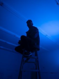 Preview wallpaper man, stepladder, dark, neon, blue