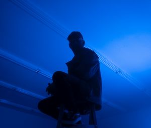 Preview wallpaper man, stepladder, dark, neon, blue