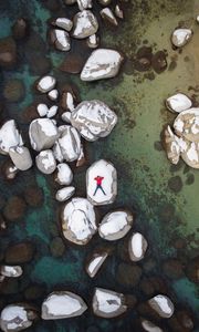 Preview wallpaper man, stones, rocks, snow, aerial view