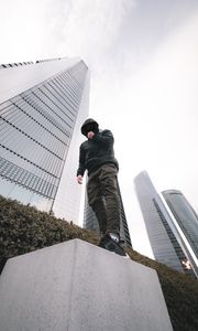 Preview wallpaper man, style, hood, bottom view, buildings