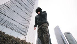 Preview wallpaper man, style, hood, bottom view, buildings