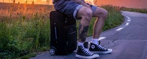 Preview wallpaper man, suitcase, sunset, tattoos