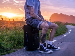 Preview wallpaper man, suitcase, sunset, tattoos