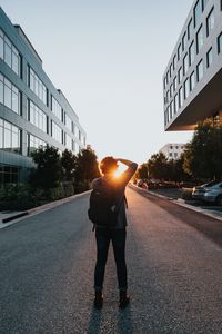Preview wallpaper man, sun, sunlight, street, city