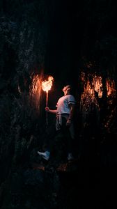 Preview wallpaper man, torch, cave, dark