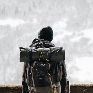 Preview wallpaper man, tourist, backpack, snow, travel