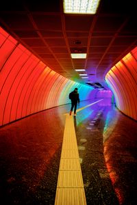 Preview wallpaper man, tunnel, backlight, colorful, rainbow