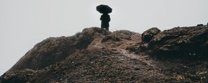 Preview wallpaper man, umbrella, alone, sad, silhouette, mountain, hill
