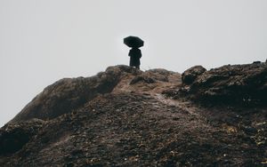 Preview wallpaper man, umbrella, alone, sad, silhouette, mountain, hill