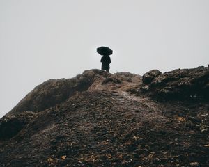 Preview wallpaper man, umbrella, alone, sad, silhouette, mountain, hill