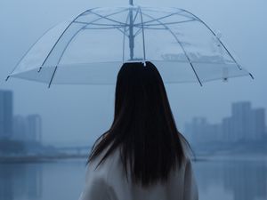 Preview wallpaper man, umbrella, girl, rain, loneliness, lonely