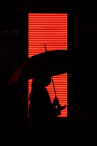 Preview wallpaper man, umbrella, silhouette, red, dark