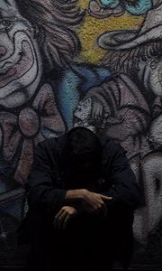 Preview wallpaper man, wall, graffiti, sadness, loneliness