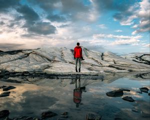 Preview wallpaper man, water, glacier, reflection