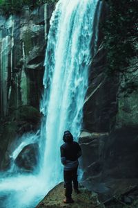 Preview wallpaper man, waterfall, stones