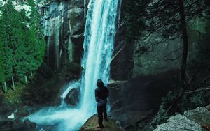 Preview wallpaper man, waterfall, stones
