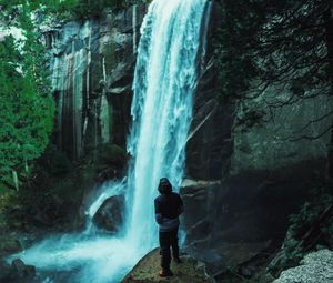 Preview wallpaper man, waterfall, stones