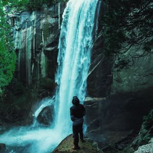 Preview wallpaper man, waterfall, stones