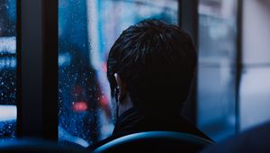 Preview wallpaper man, window, rain, headphones, melancholy, trip