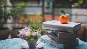 Preview wallpaper mandarin, books, table, reading, light