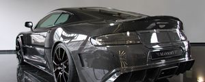 Preview wallpaper mansory, aston martin, dbs, 2009, carbon, black, rear view, style, reflected