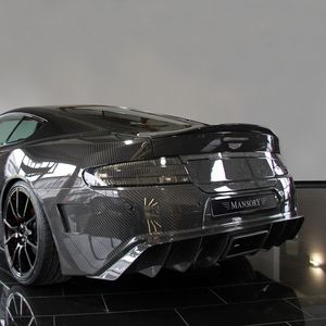 Preview wallpaper mansory, aston martin, dbs, 2009, carbon, black, rear view, style, reflected