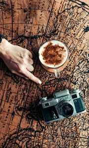 Preview wallpaper map, hand, cup, camera