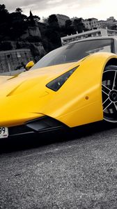 Preview wallpaper marussia, yellow, blue, city, front bumper